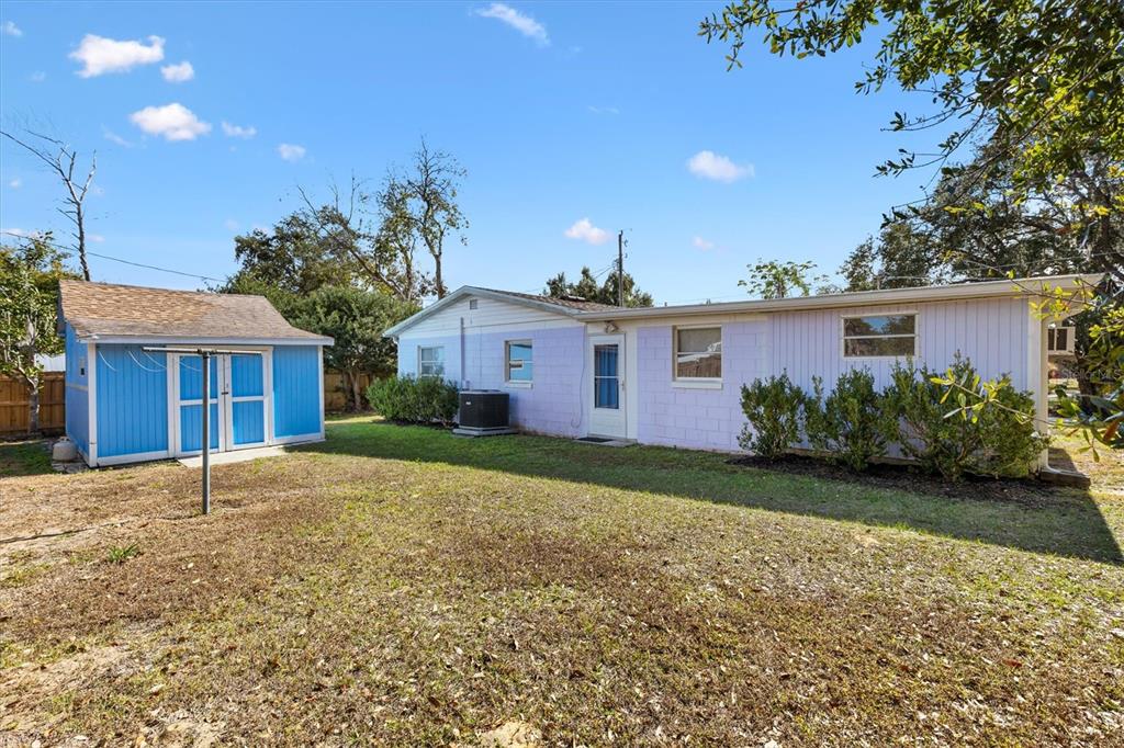 5605 Berts Road Lady Lake, FL 32159 - Photo 28 of 38 a front view of a house with garden