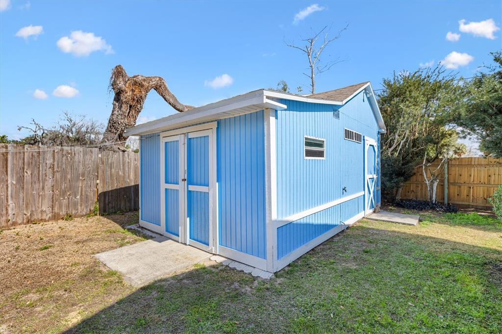 5605 Berts Road Lady Lake, FL 32159 - Photo 30 of 38 a front view of a house with a yard
