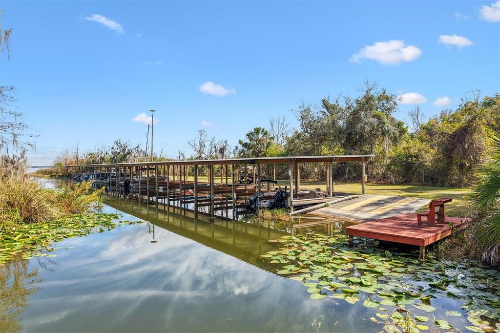 5605 Berts Road Lady Lake, FL 32159 - Photo 35 of 38 a view of a swimming pool with a lounge chairs