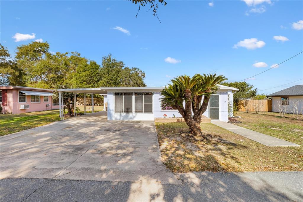5605 Berts Road Lady Lake, FL 32159 - Photo 4 of 38 a view of a yard in front of a house