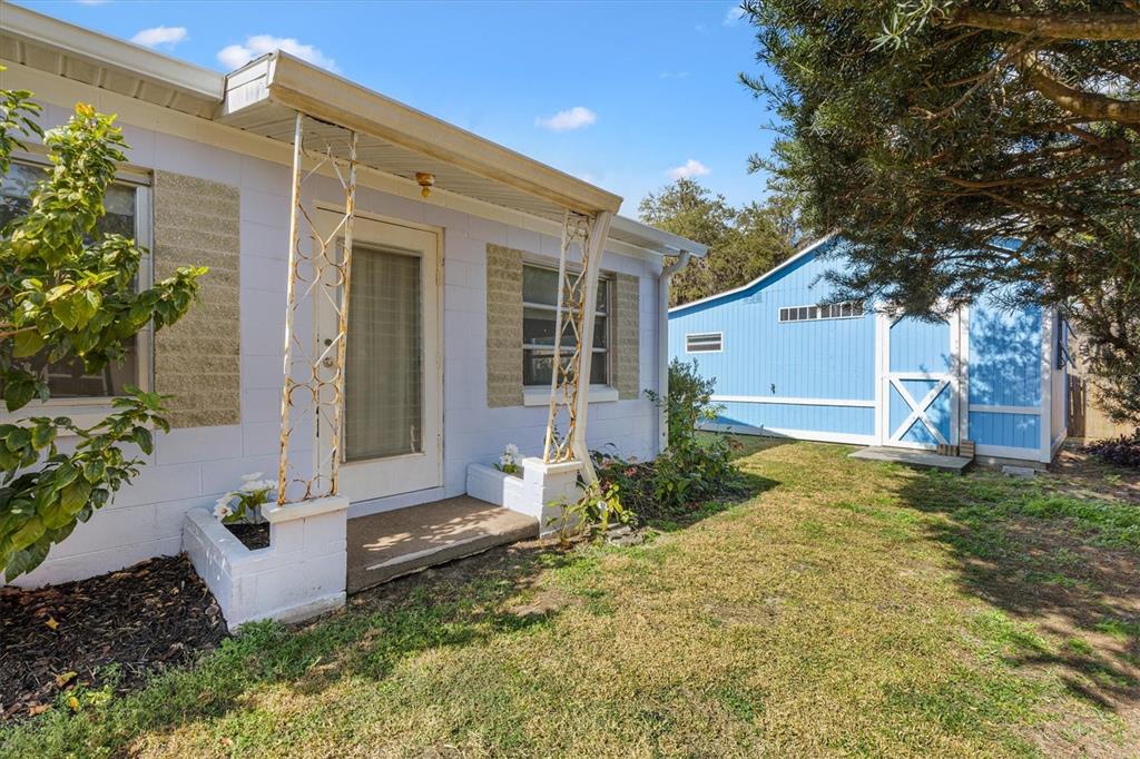5605 Berts Road Lady Lake, FL 32159 - Photo 6 of 38 front view of a house with a yard