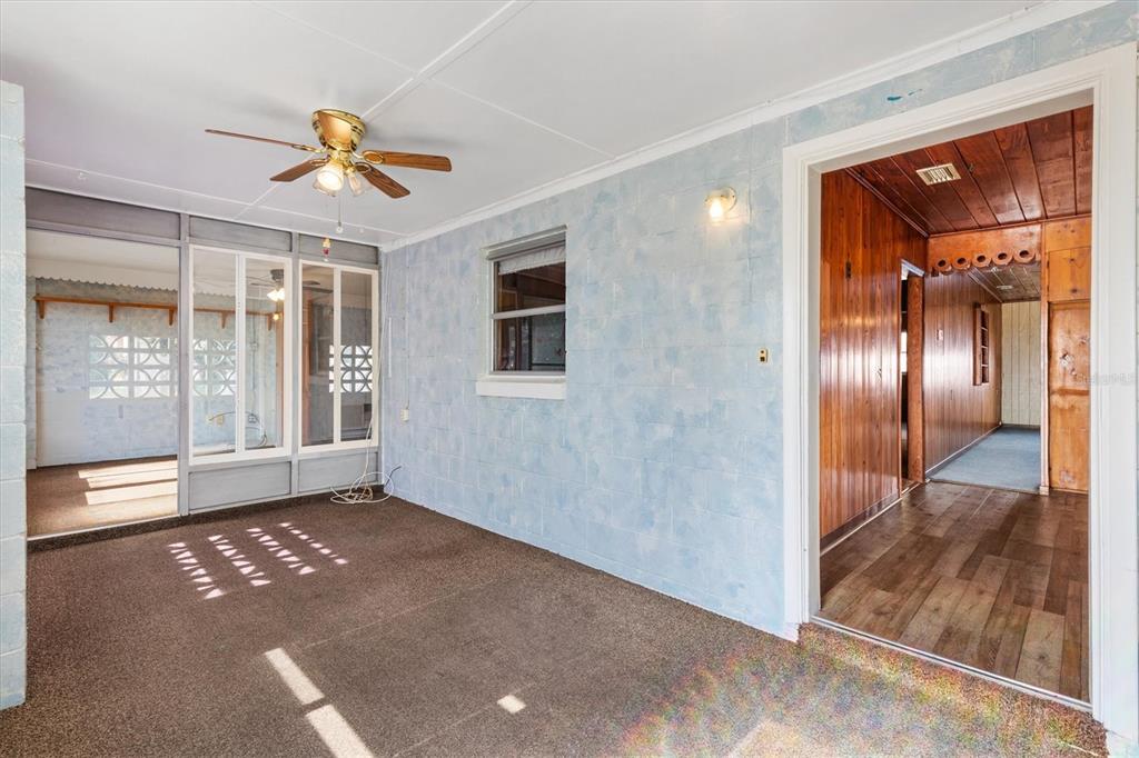 5605 Berts Road Lady Lake, FL 32159 - Photo 7 of 38 a view of a livingroom with a ceiling fan and window