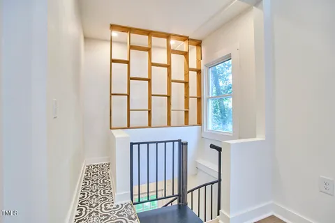 a view of a balcony with wooden floor