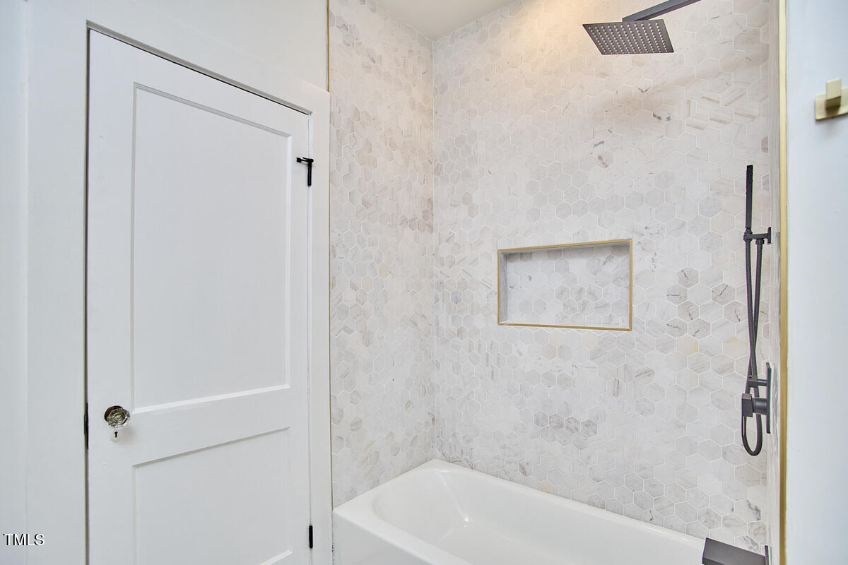 2203 University Drive Durham, NC 27707 - Photo 17 of 40 a bathroom with a shower