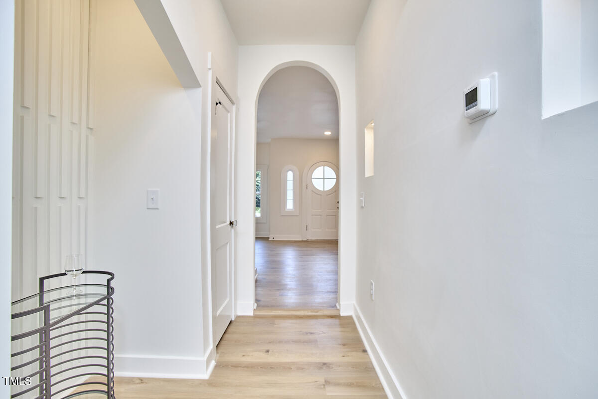 2203 University Drive Durham, NC 27707 - Photo 20 of 40 a view of a livingroom with wooden floor and a bathroom