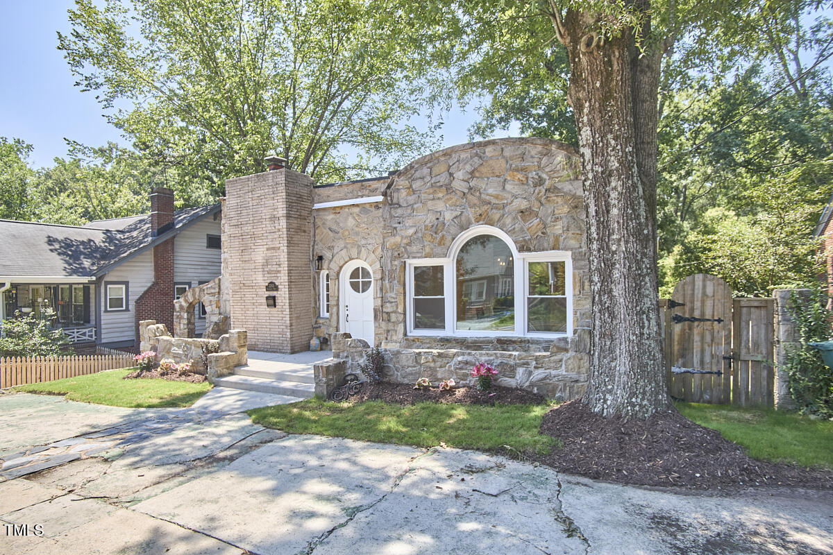 2203 University Drive Durham, NC 27707 - Photo 2 of 40 a front view of a house with garden