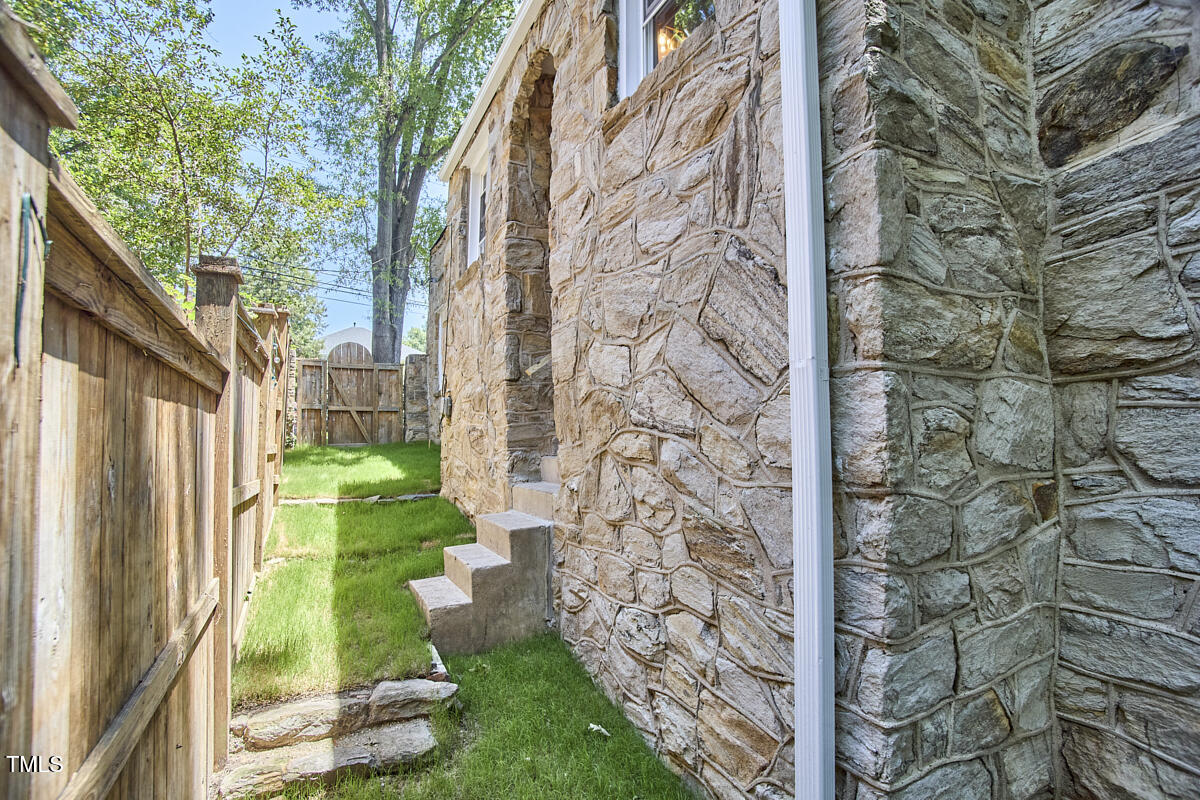 2203 University Drive Durham, NC 27707 - Photo 30 of 40 a view of a pathway of a house with a yard
