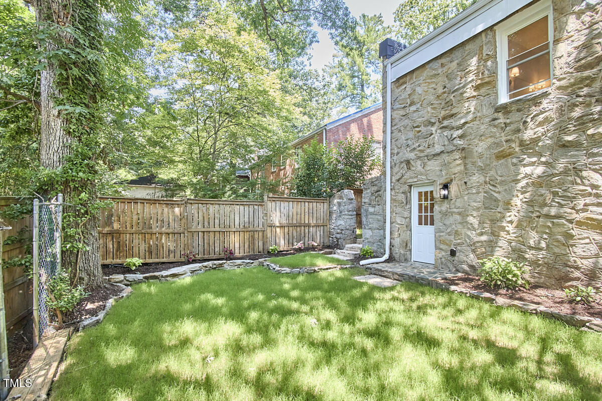2203 University Drive Durham, NC 27707 - Photo 33 of 40 a view of a backyard with a small cabin