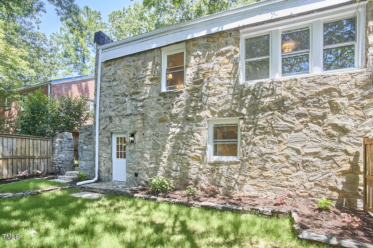2203 University Drive Durham, NC 27707 - Photo 35 of 40 front view of a brick house with a yard