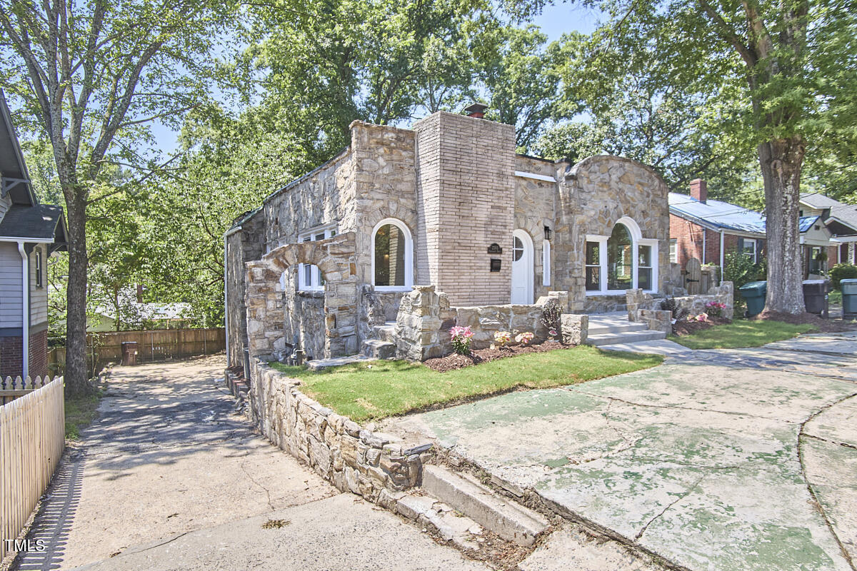 2203 University Drive Durham, NC 27707 - Photo 38 of 40 a front view of a house with garden