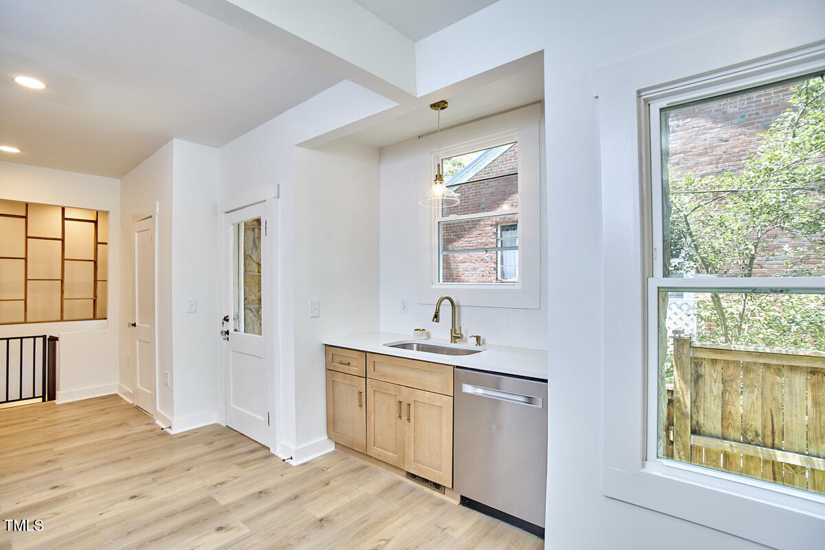 2203 University Drive Durham, NC 27707 - Photo 10 of 40 a kitchen with a sink cabinets appliances and a window