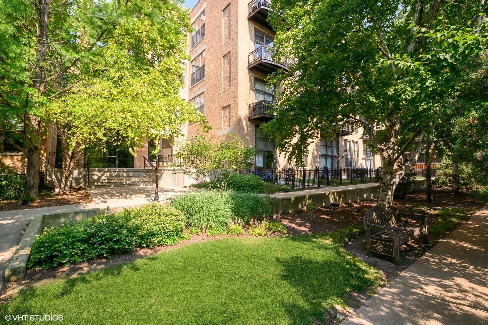 a view of a park with large trees