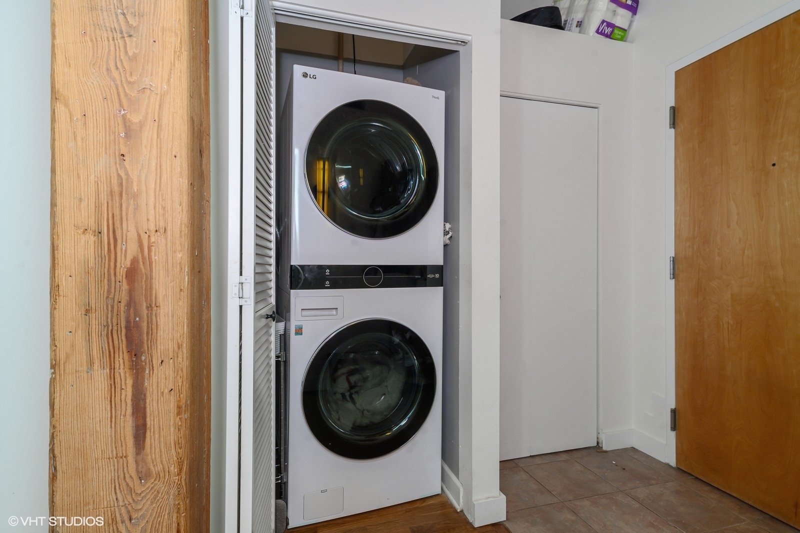 1330 West Monroe Street, Unit 311 Chicago, IL 60607 - Photo 15 of 16 a view of a hallway with washer and dryer