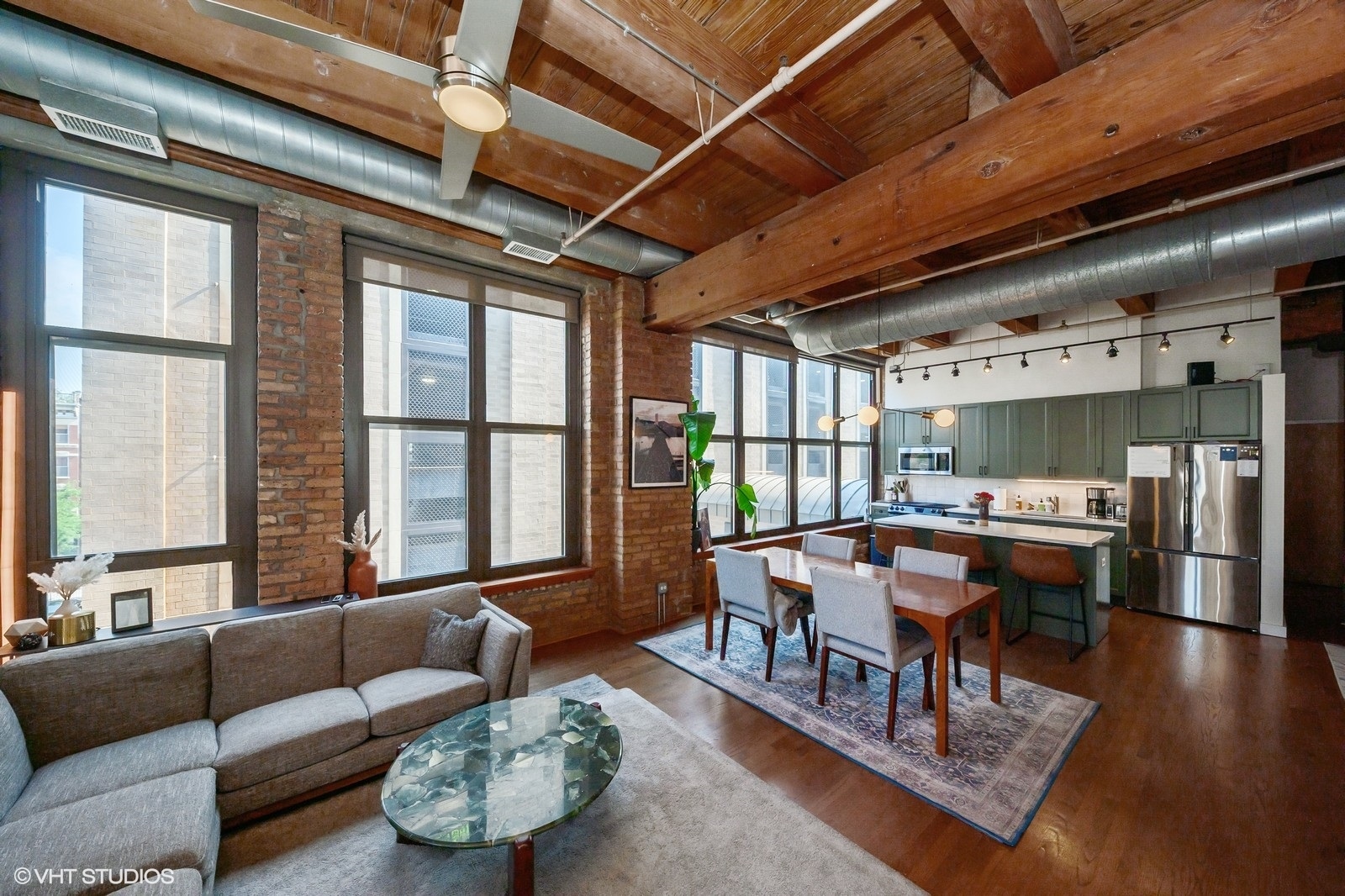 1330 West Monroe Street, Unit 311 Chicago, IL 60607 - Photo 2 of 16 a living room with furniture and a large window