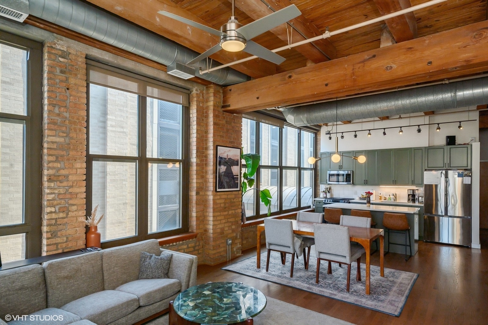 1330 West Monroe Street, Unit 311 Chicago, IL 60607 - Photo 6 of 16 a living room with furniture and a large window