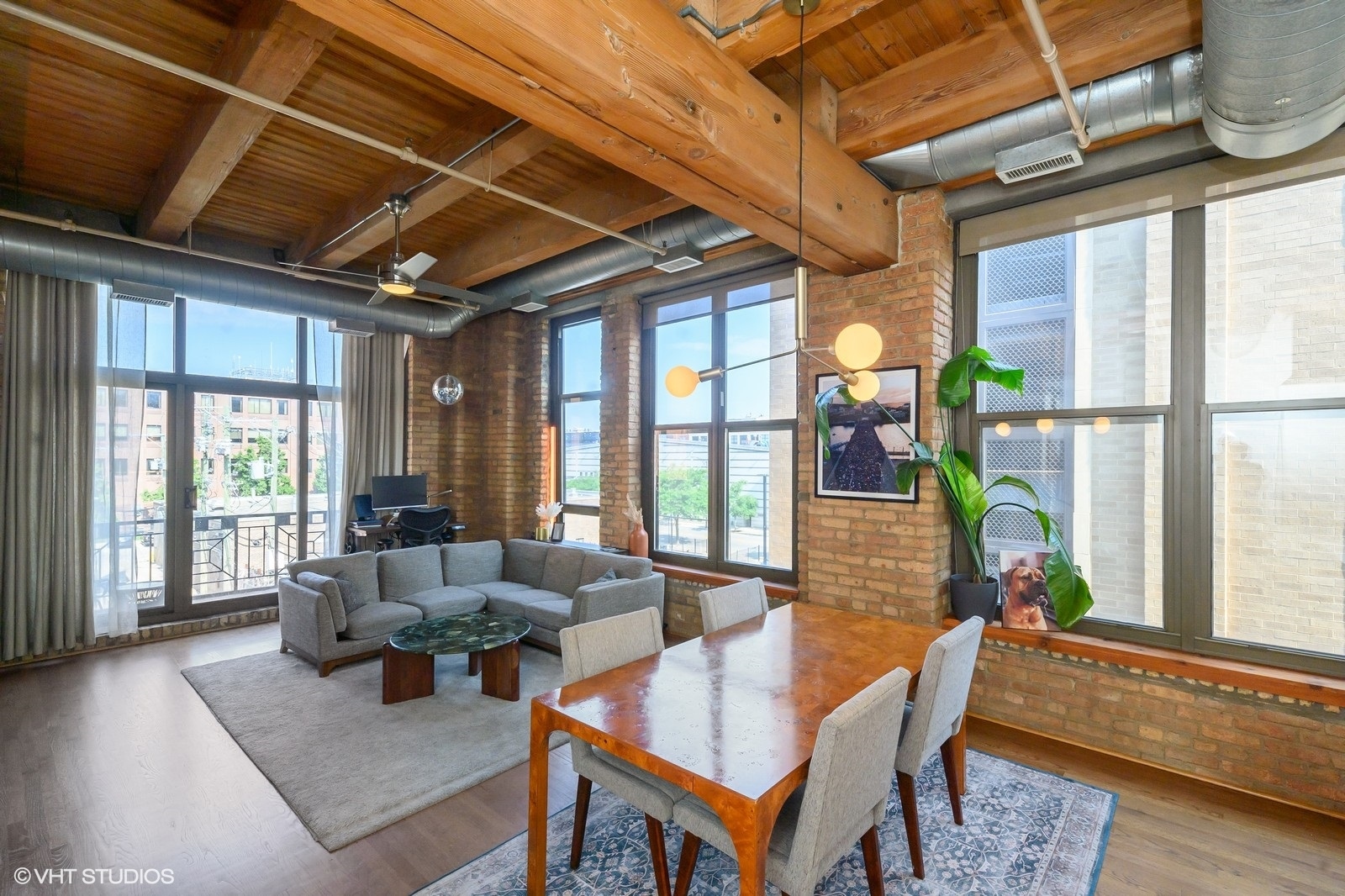 1330 West Monroe Street, Unit 311 Chicago, IL 60607 - Photo 10 of 16 a living room with furniture and a large window