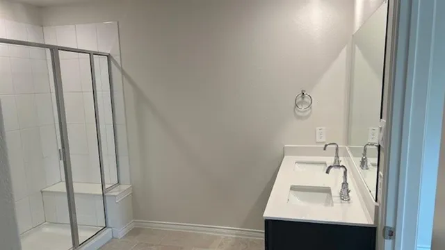 a bathroom with a sink and mirror