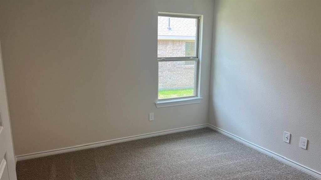 1403 Forever Way Princeton, TX 75407 - Photo 8 of 11 an empty room with a window