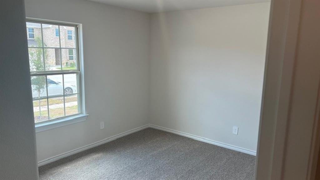 1403 Forever Way Princeton, TX 75407 - Photo 10 of 11 an empty room with a window