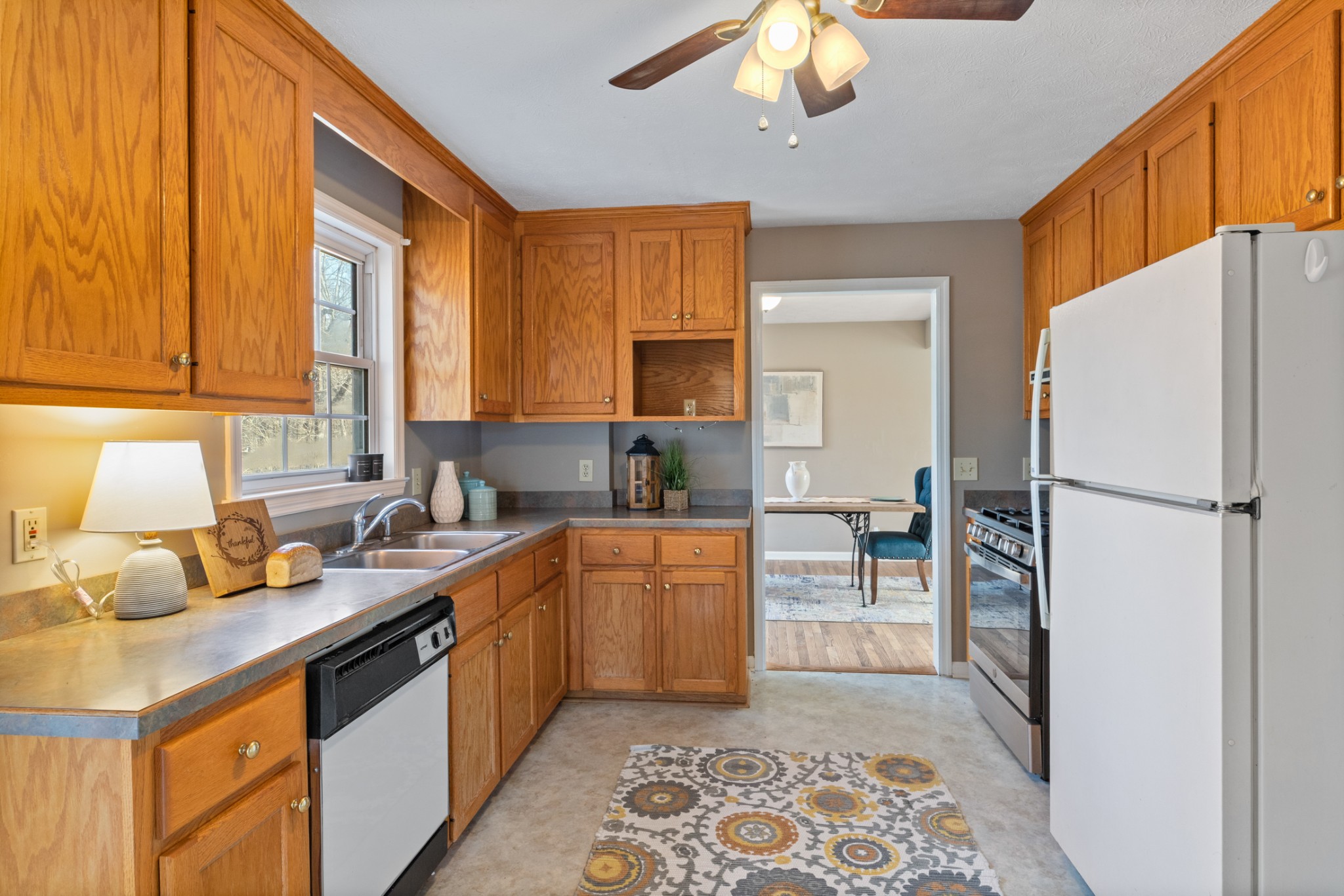 251 Rouse Road Dickson, TN 37055 - Photo 11 of 46 a kitchen with a refrigerator and a sink