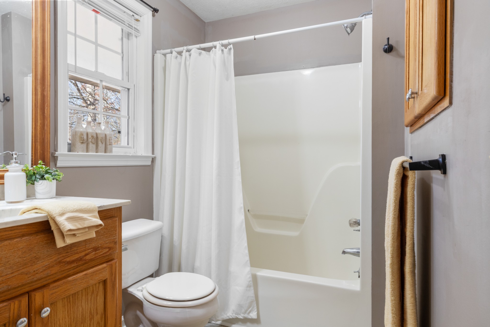 251 Rouse Road Dickson, TN 37055 - Photo 19 of 46 a white toilet sitting next to a bathroom sink