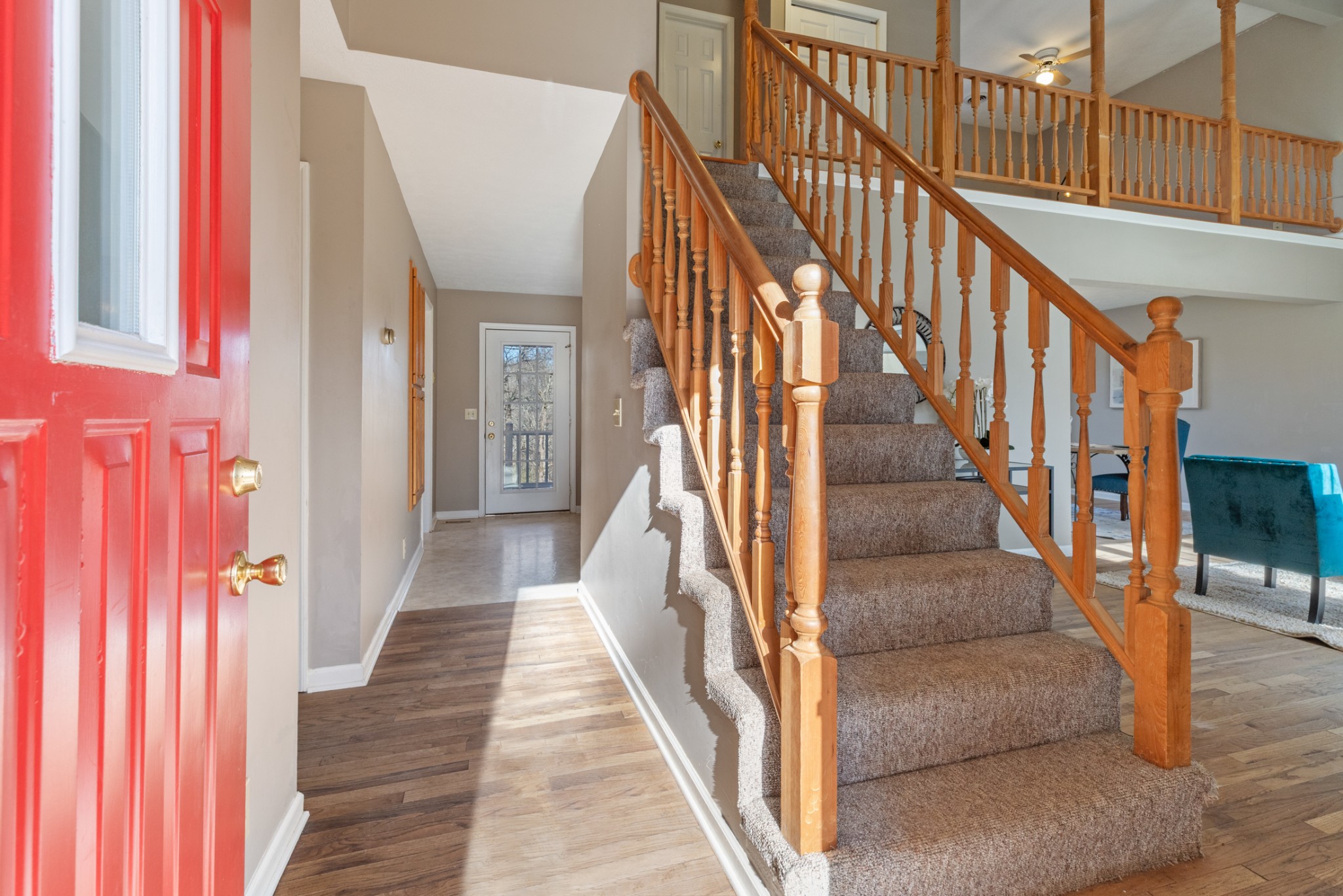 251 Rouse Road Dickson, TN 37055 - Photo 2 of 46 a view of staircase with lots of frames on wall and a window