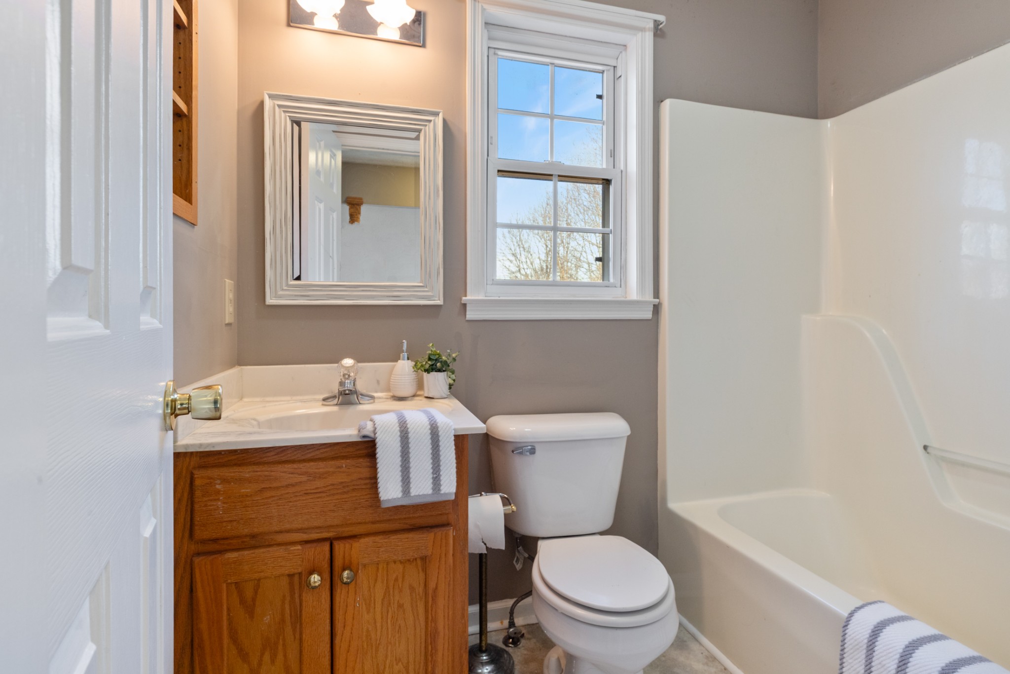 251 Rouse Road Dickson, TN 37055 - Photo 22 of 46 a bathroom with a sink a toilet and bathtub