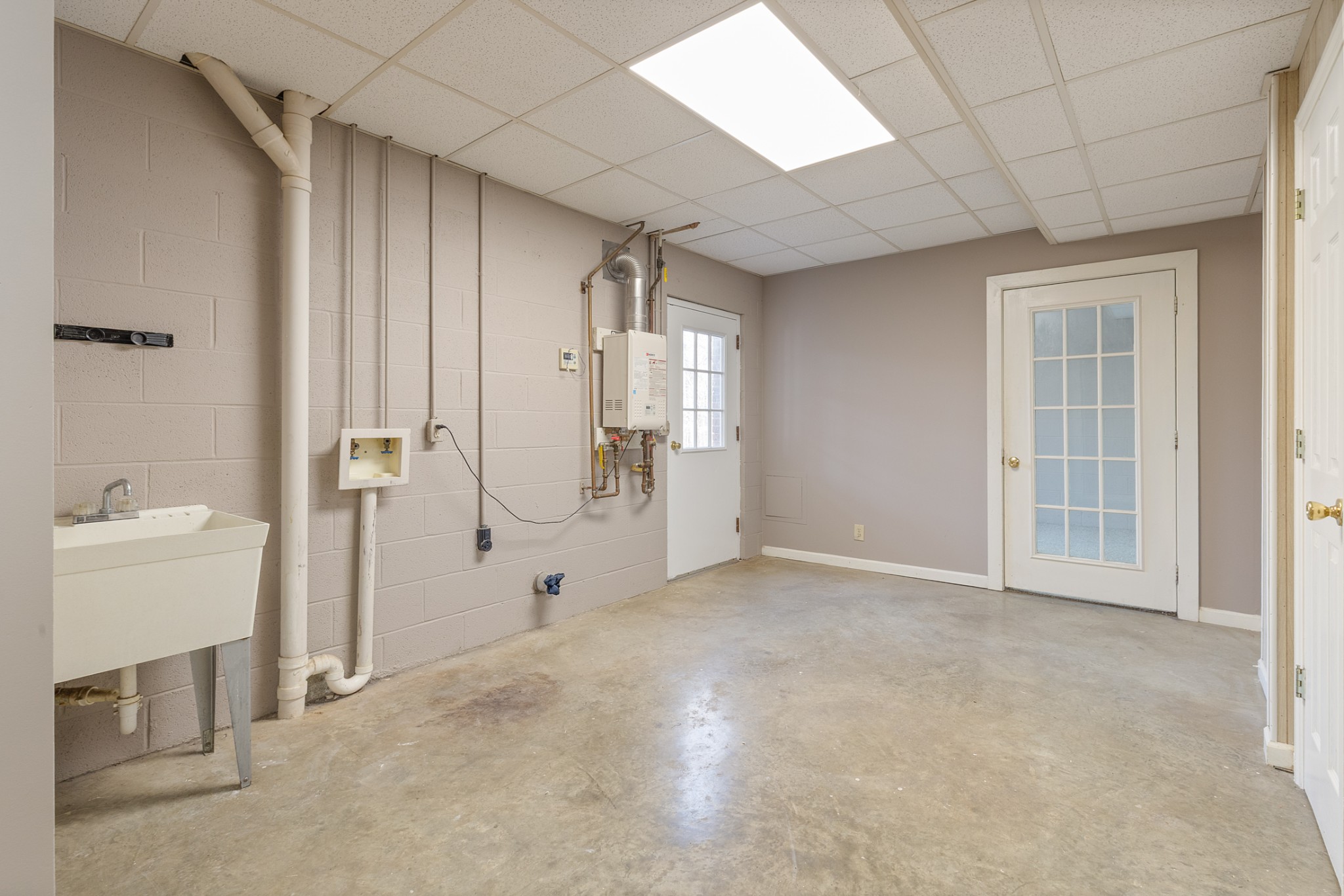 251 Rouse Road Dickson, TN 37055 - Photo 29 of 46 an empty room with a cabinet and a bathroom