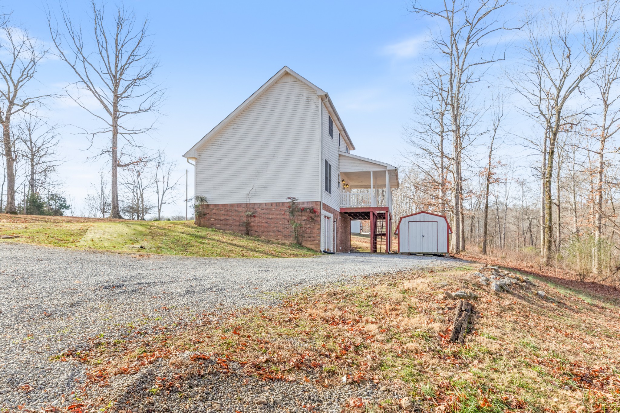 251 Rouse Road Dickson, TN 37055 - Photo 35 of 46 a view of a house with a yard covered in snow