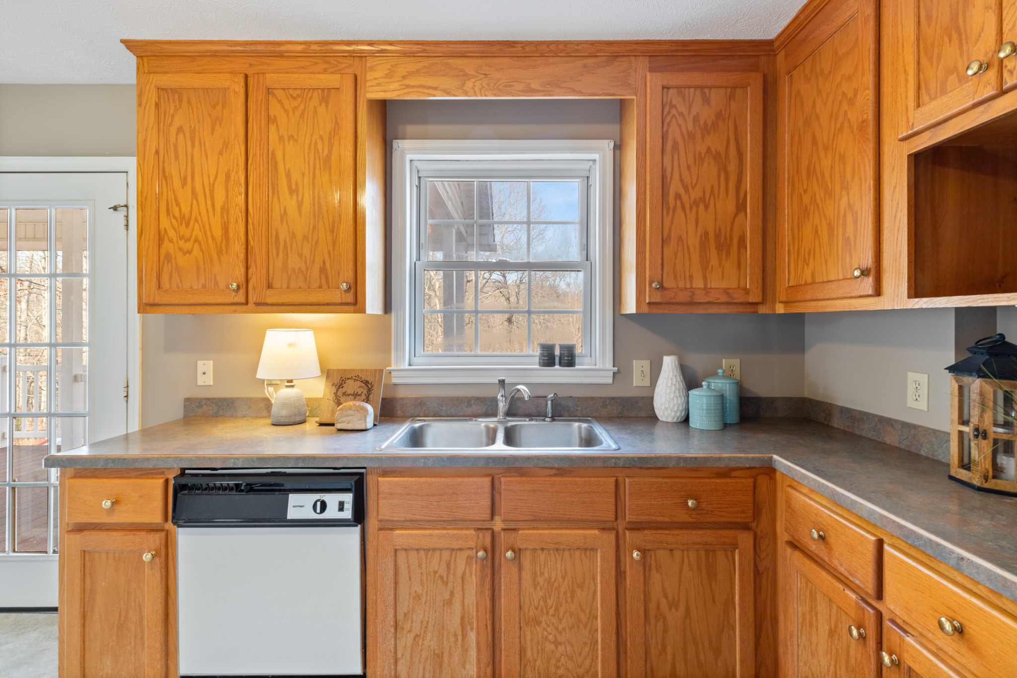 251 Rouse Road Dickson, TN 37055 - Photo 8 of 46 a kitchen with stainless steel appliances granite countertop a sink stove and cabinets