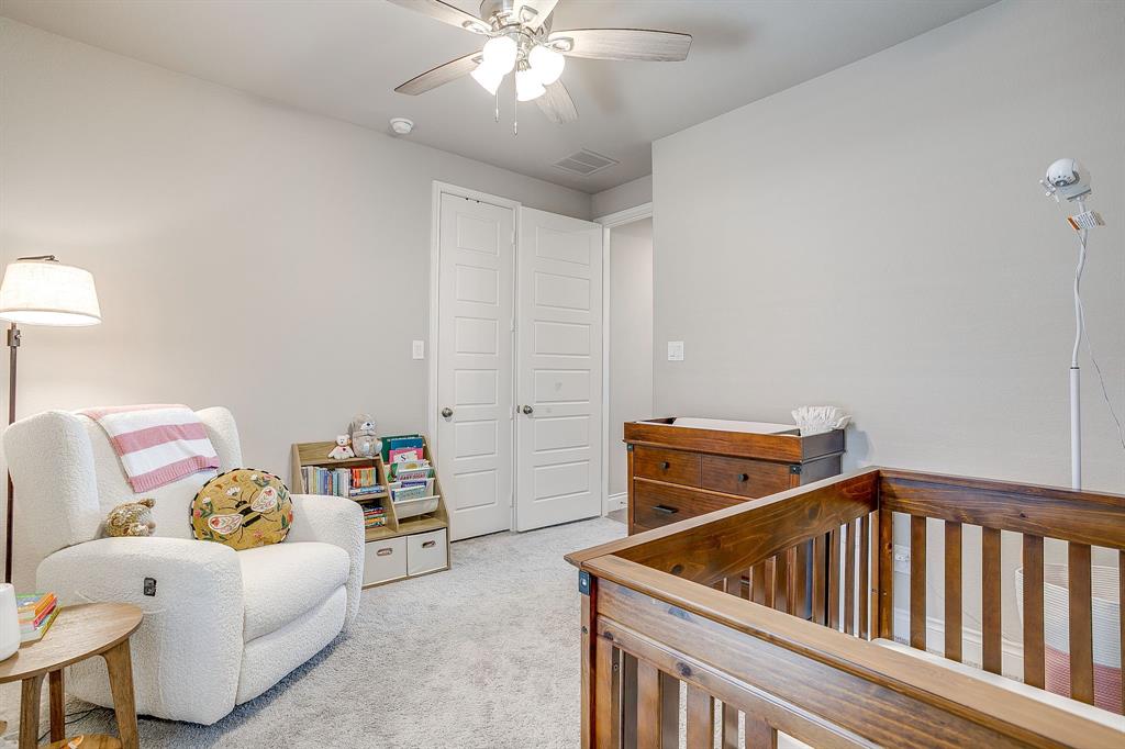 5709 Pope Creek Road Fort Worth, TX 76126 - Photo 24 of 39 A view of the guest bedroom from its private ensuite bath.