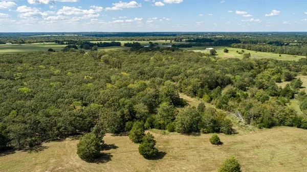 a view of a lake with a yard