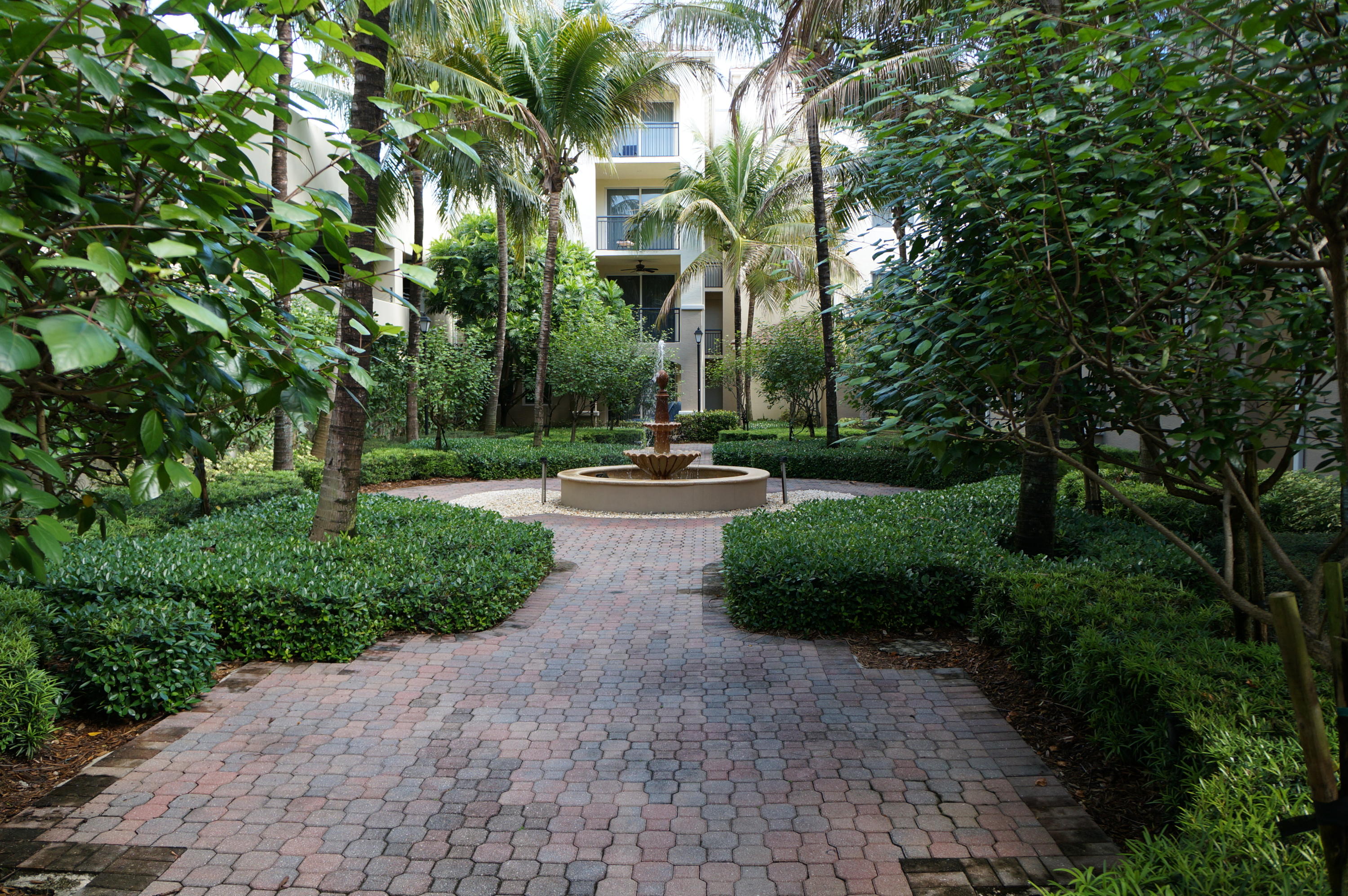 1121 Renaissance Way, Unit 121 Boynton Beach, FL 33426 - Photo 13 of 28 a view of a park with plants and trees