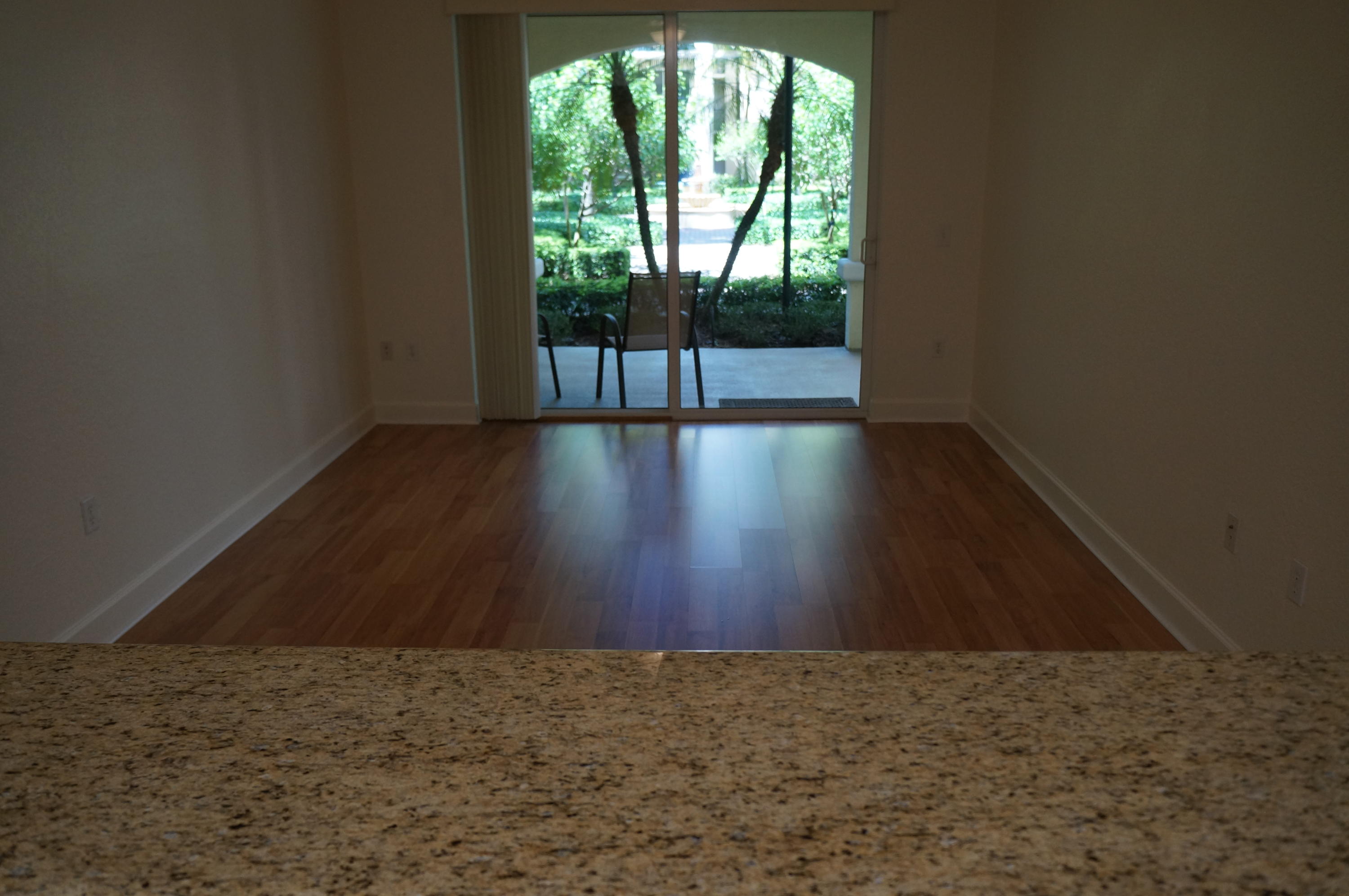 1121 Renaissance Way, Unit 121 Boynton Beach, FL 33426 - Photo 16 of 28 a view of wooden floor and window in an empty room