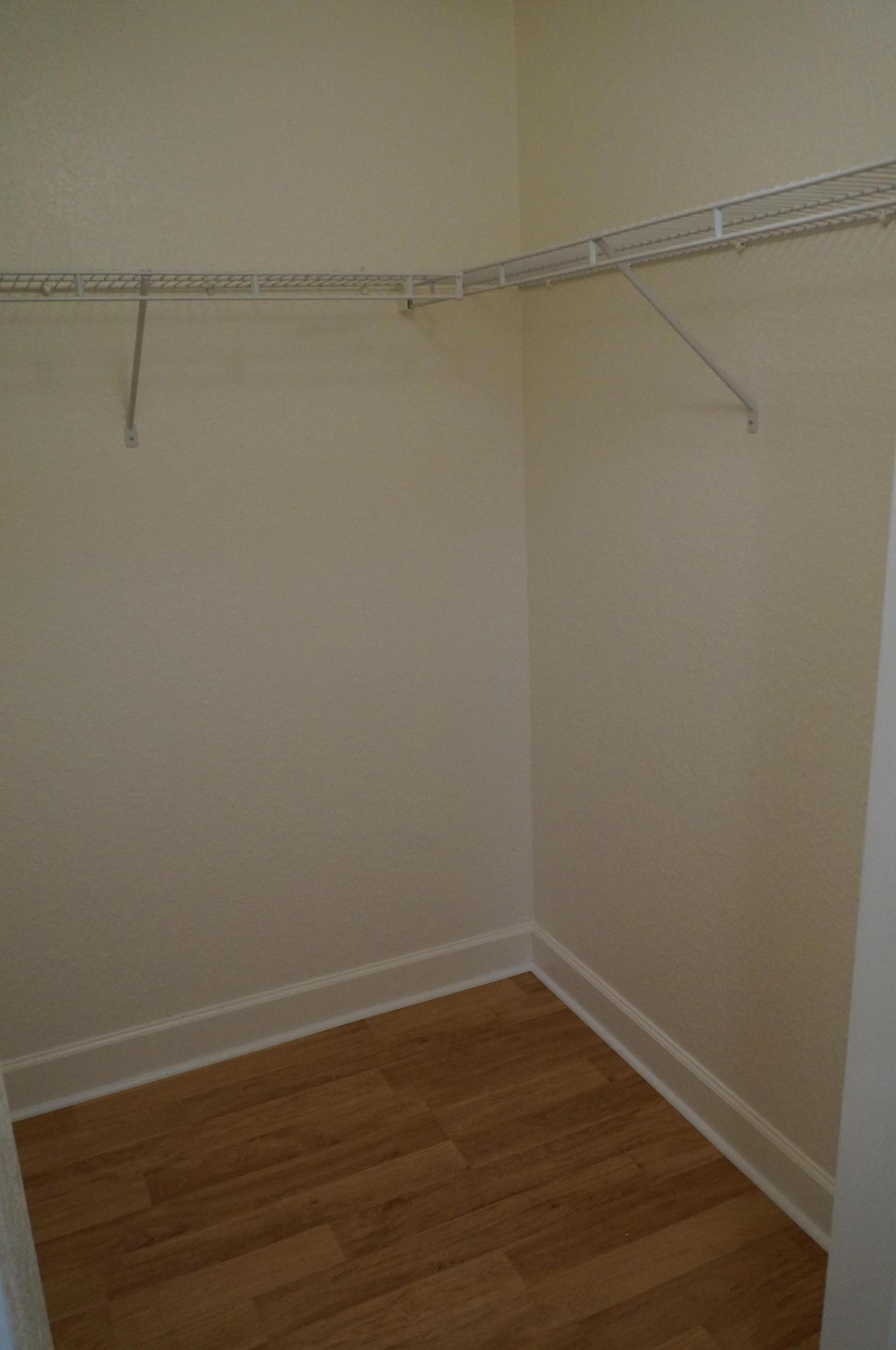 1121 Renaissance Way, Unit 121 Boynton Beach, FL 33426 - Photo 21 of 28 a view of a room with racks on the wall