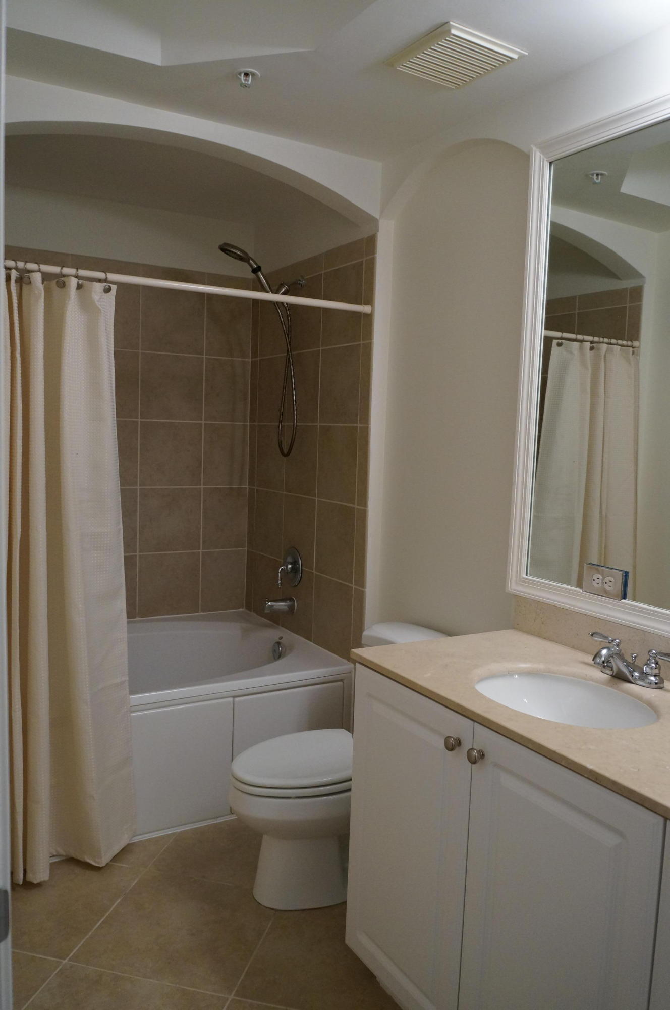 1121 Renaissance Way, Unit 121 Boynton Beach, FL 33426 - Photo 22 of 28 a bathroom with a toilet a sink and shower