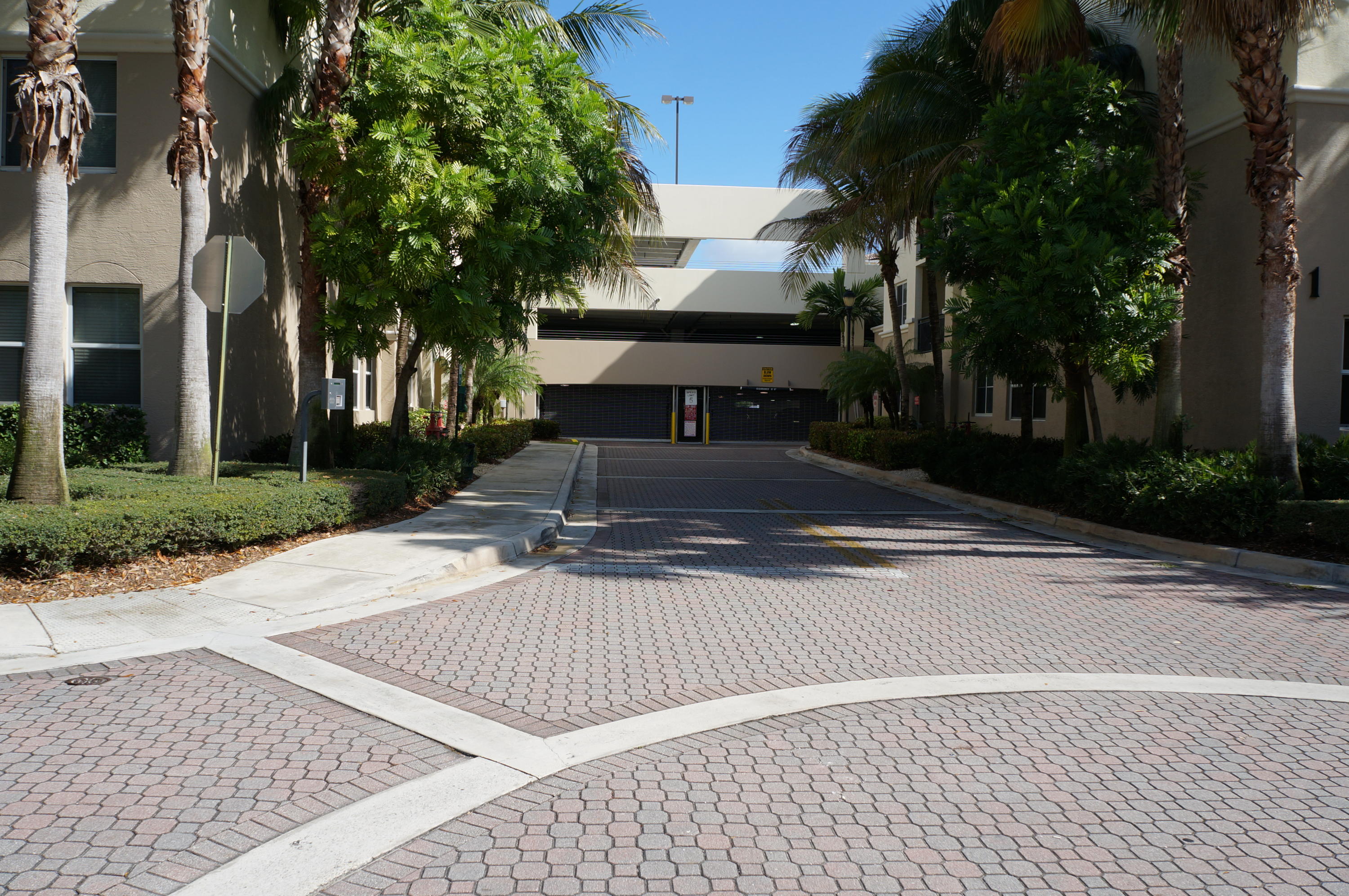 1121 Renaissance Way, Unit 121 Boynton Beach, FL 33426 - Photo 23 of 28 front view of a house with a yard