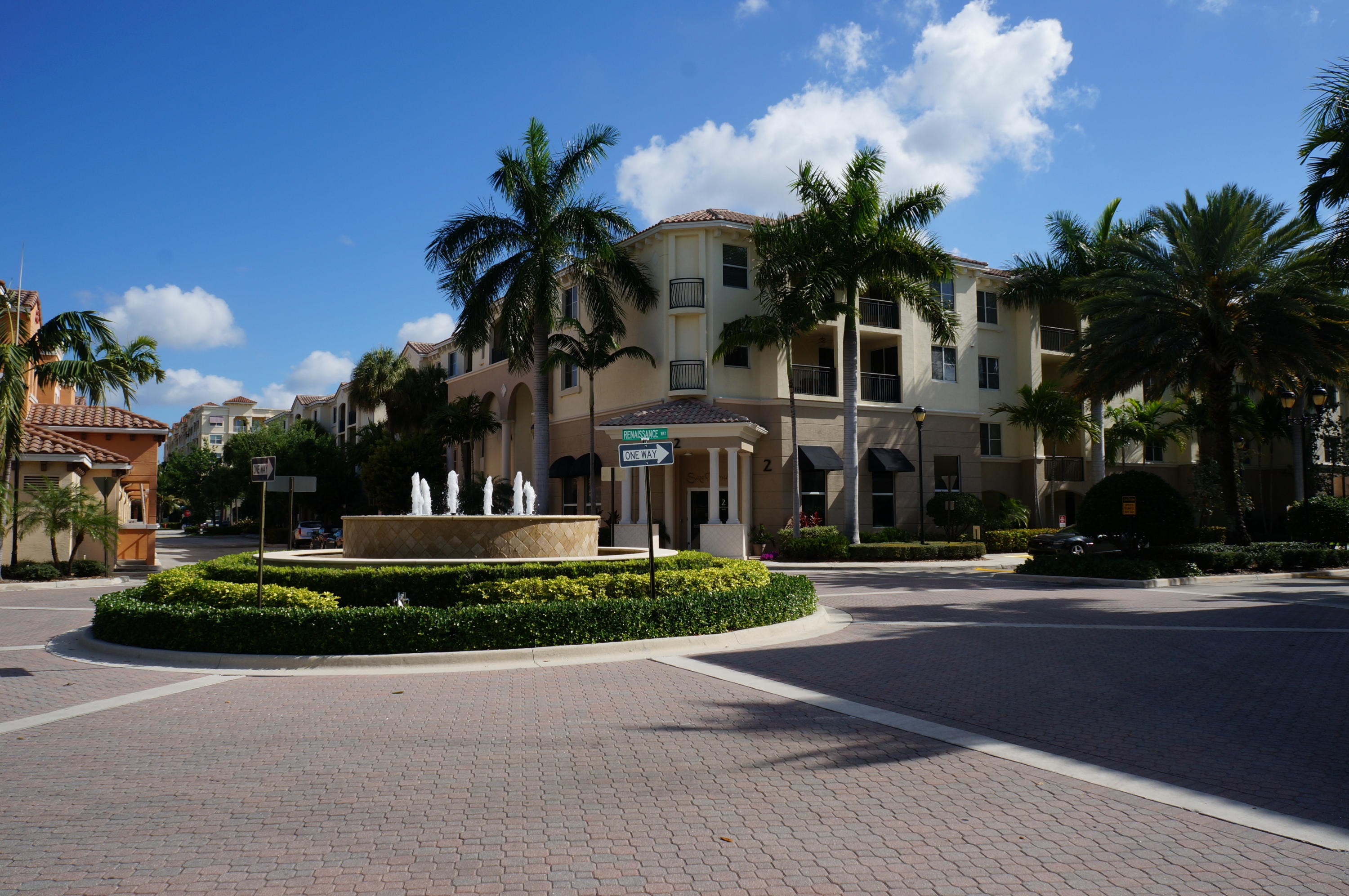1121 Renaissance Way, Unit 121 Boynton Beach, FL 33426 - Photo 24 of 28 a couple of palm trees in front of house