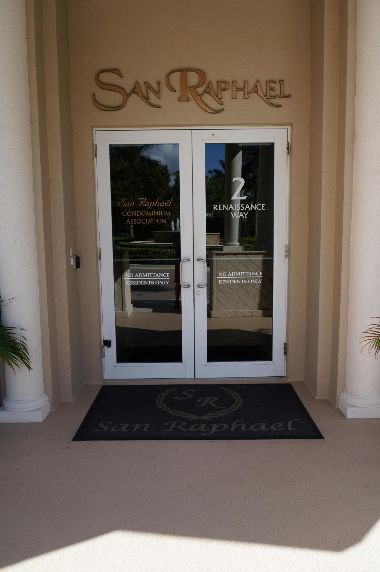 1121 Renaissance Way, Unit 121 Boynton Beach, FL 33426 - Photo 26 of 28 a view of a hallway with wooden door