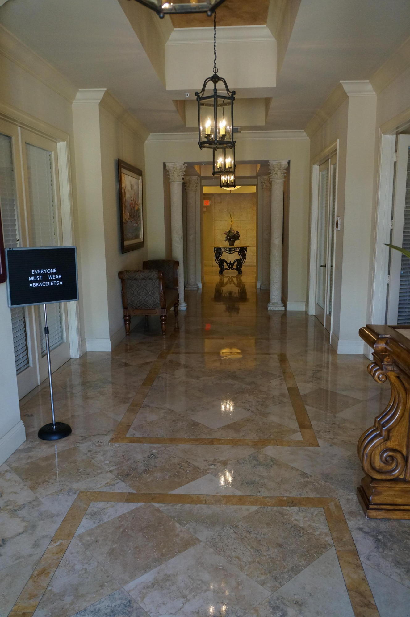 1121 Renaissance Way, Unit 121 Boynton Beach, FL 33426 - Photo 27 of 28 a lobby with furniture and a chandelier