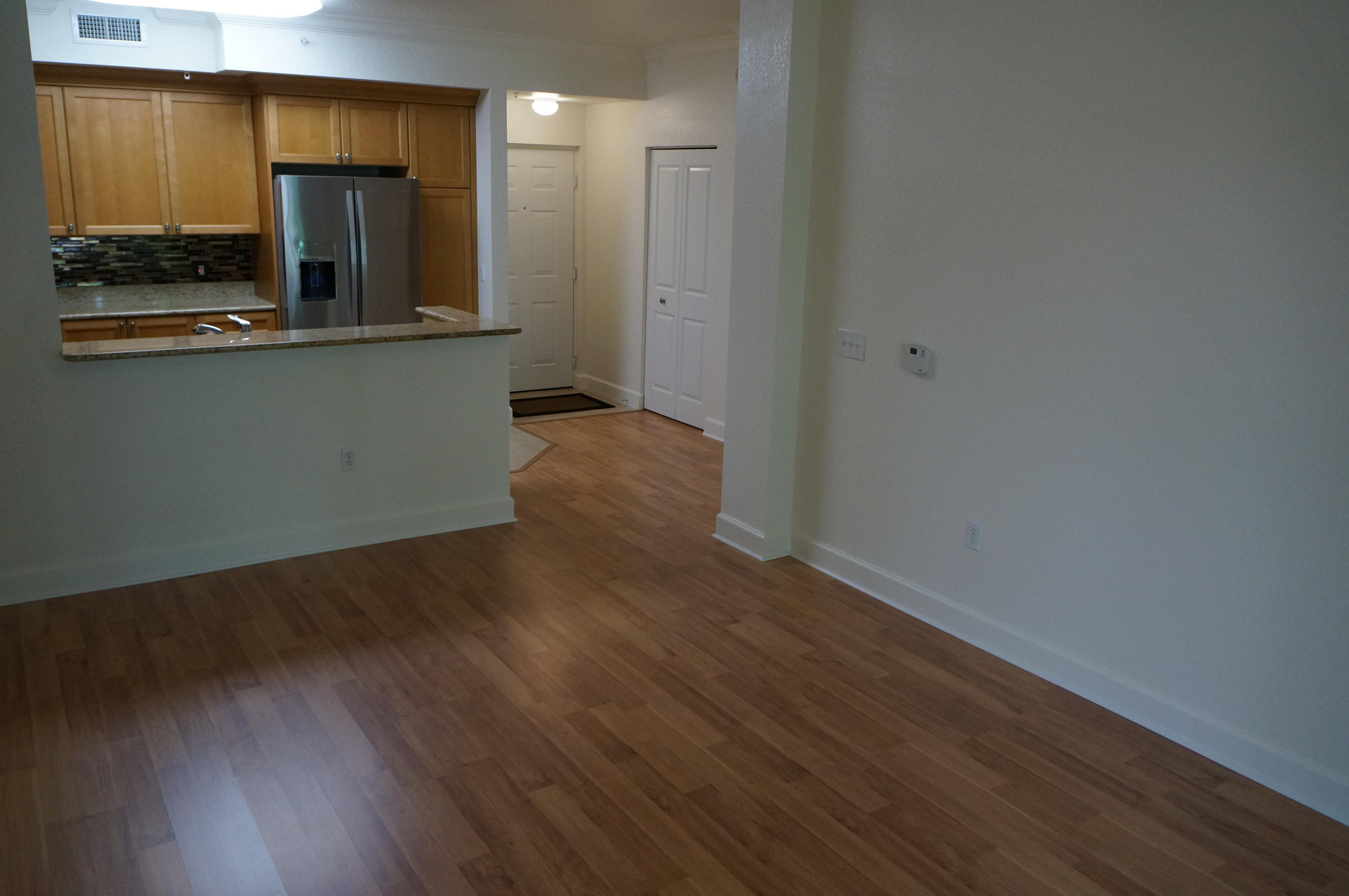 1121 Renaissance Way, Unit 121 Boynton Beach, FL 33426 - Photo 7 of 28 a view of a kitchen with wooden floor and a sink