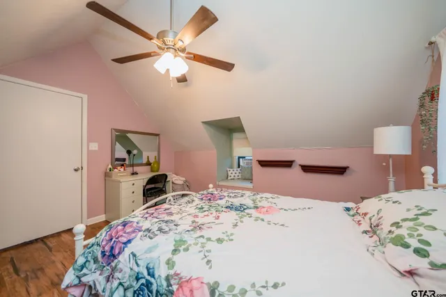 a bedroom with a bed and a dresser