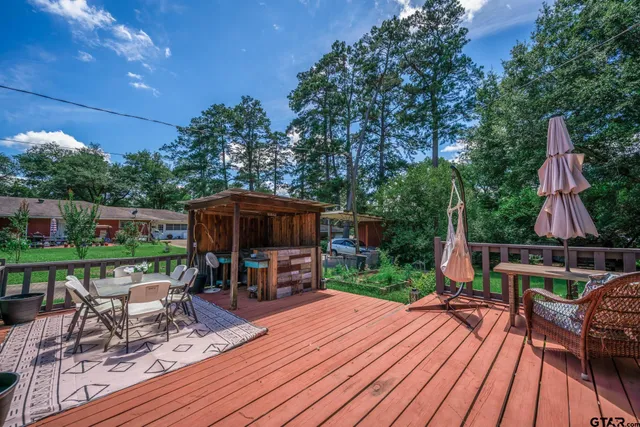 a view of a backyard with sitting area