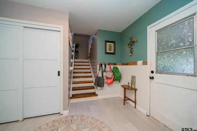 a view of entryway with stairs and furniture