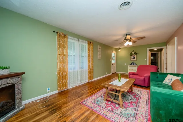 a living room with furniture and a fireplace