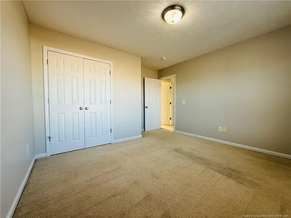 a bathroom with a double vanity sink toilet and shower