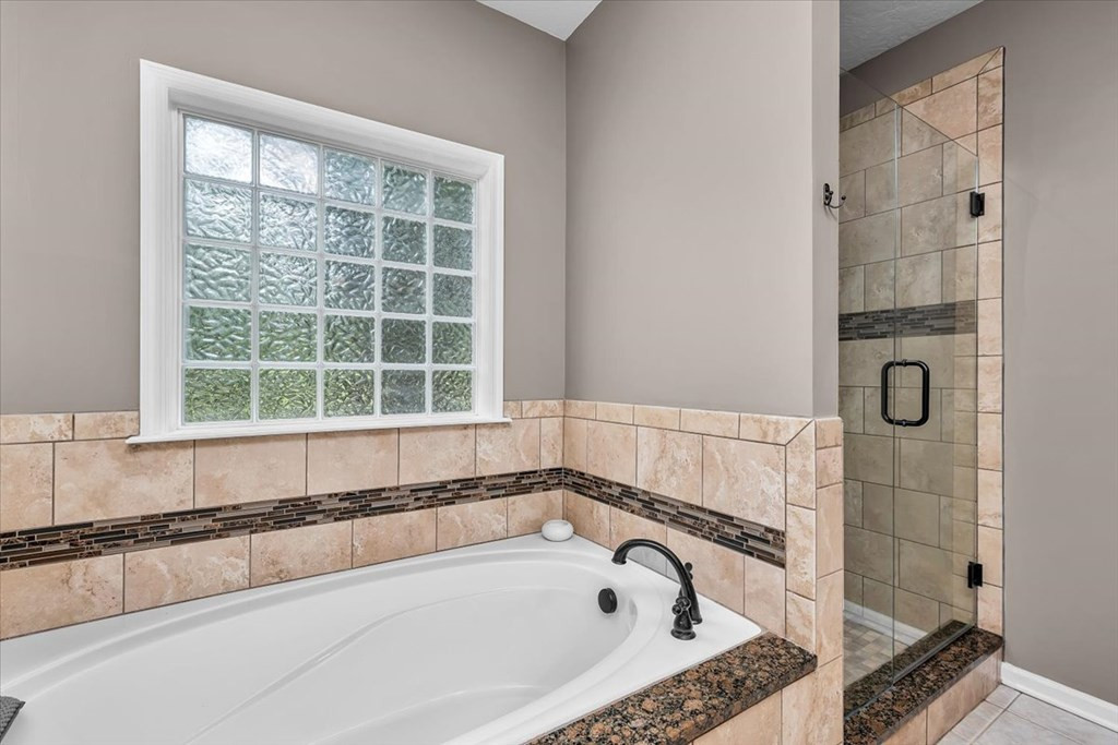 3198 Ray Owens Road Appling, GA 30802 - Photo 24 of 41 Owner bath with 6 ft tub and tiled shower