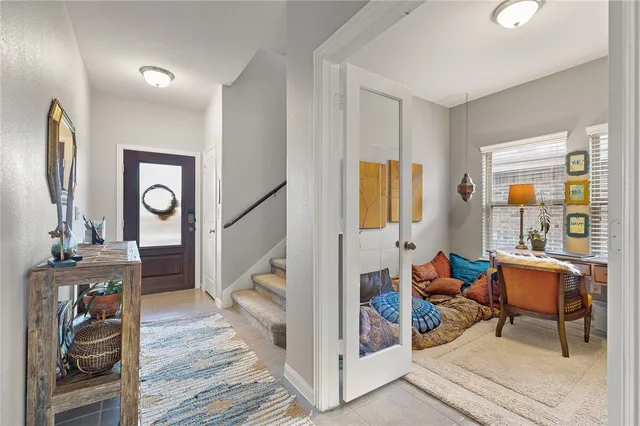 a view of a livingroom with furniture and a mirror
