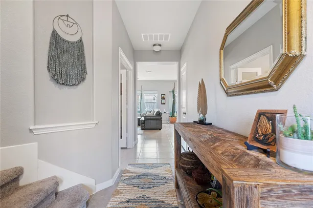 a en suite bathroom with a granite countertop sink and a mirror