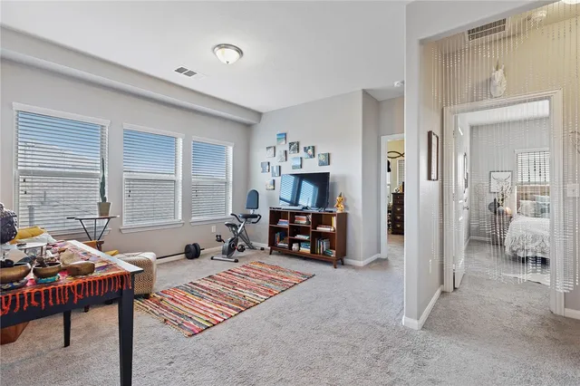 a bedroom with furniture and a fireplace